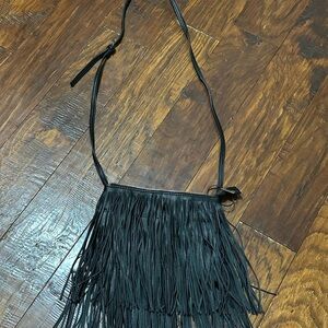 Carlos Santana fringe bag .